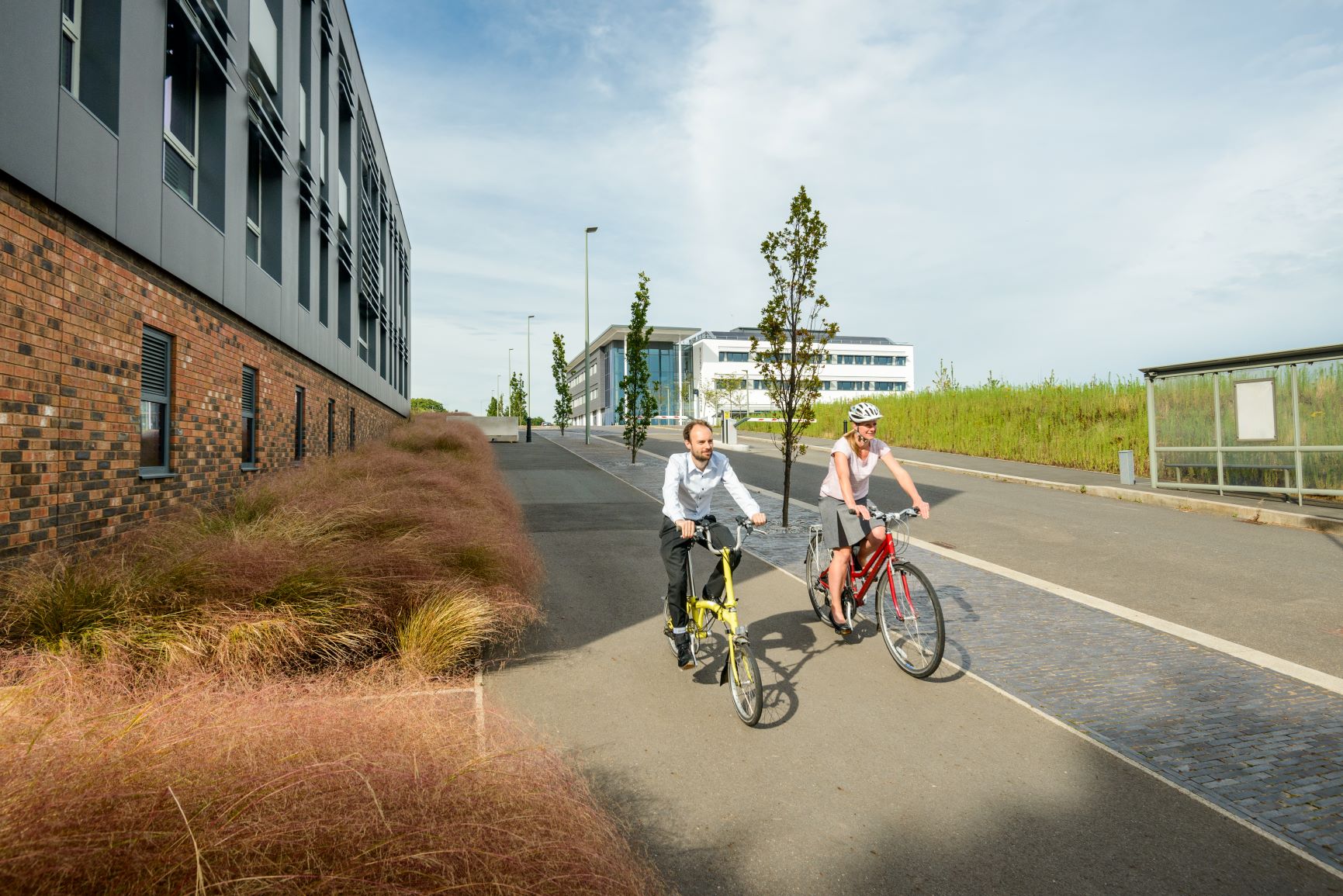 Man and woman cycling at Exeter Science Park